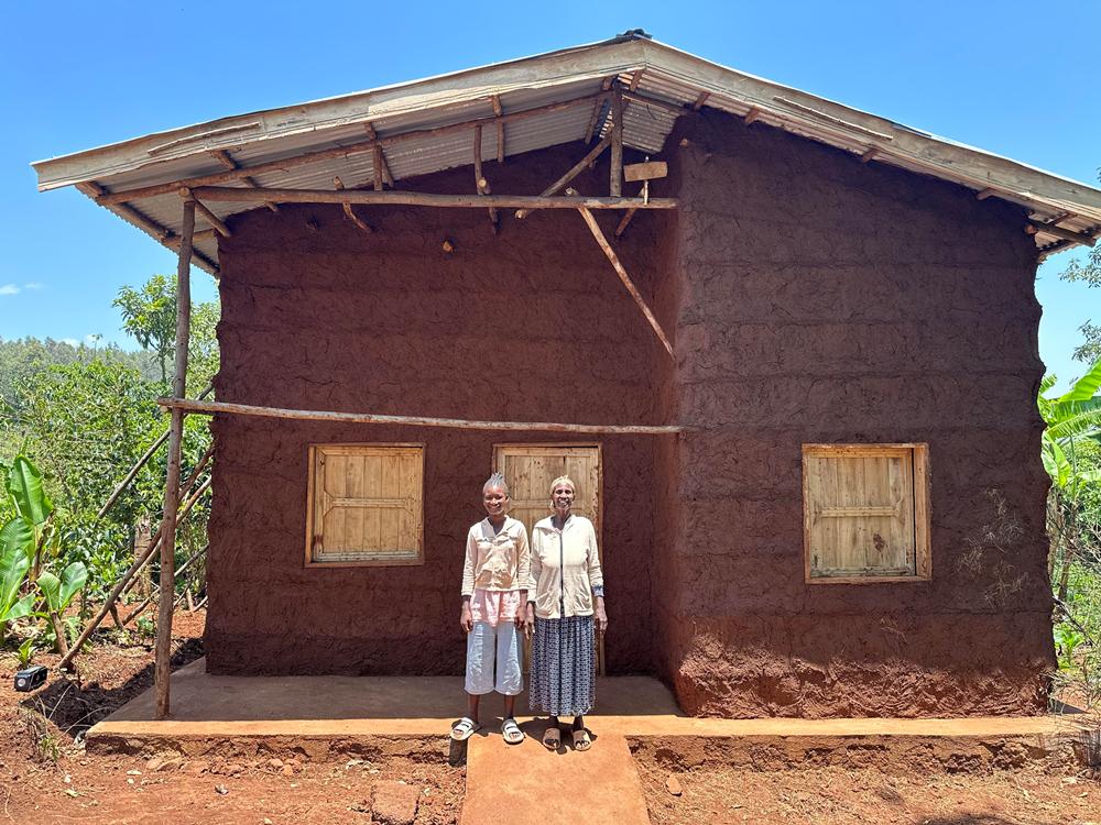 Sidama, Ethiopia elderly women outside new safe home—Hawassa Hope Building Hope initiative providing secure housing for vulnerable families.