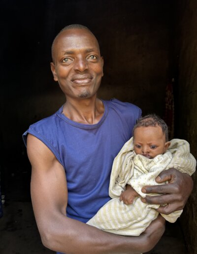 Father in Ethiopia holding his baby in Hawassa Hope's sponsorship program